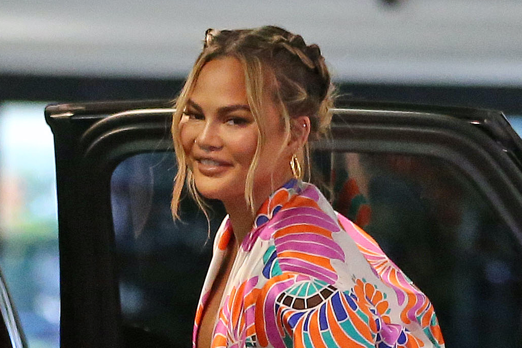 Chrissy Teigen Goes Glam in a Colorful Silk Set and Gold Gucci Sandals for Shopping