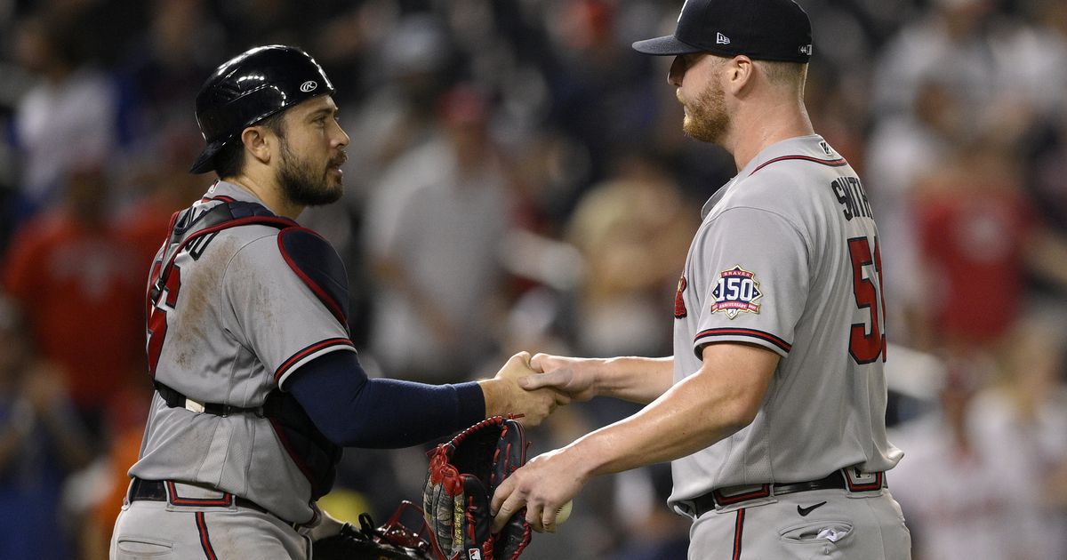Four solo homers lift Braves back into tie for first place
