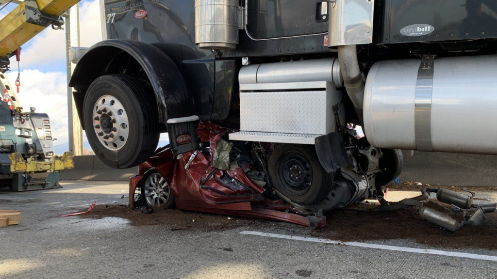 Woman walks out of her car after it is crushed by 18-wheeler truck – Times Now